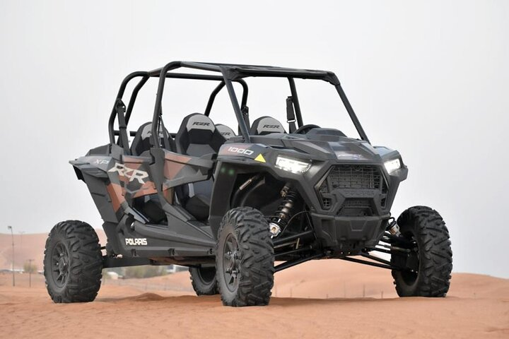 Experience the thrill of navigating Dubai's stunning sand dunes in a powerful 1000cc dune buggy perfect for adventurers seeking an unforgettable off-road journey in the desert.